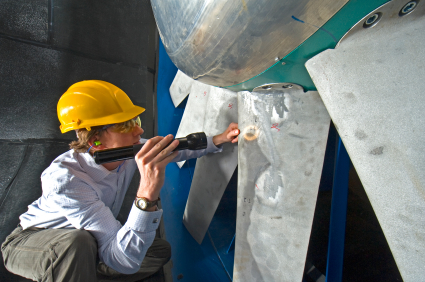 Aerospace engineer inspecting an industrial windtunnel