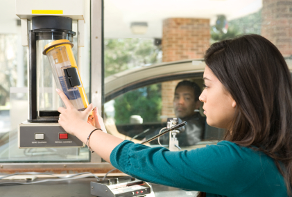 Bank teller at bank drive-thru window